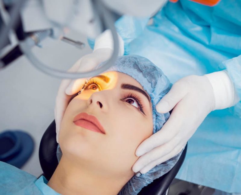 A woman getting an eye procedure done on her face.