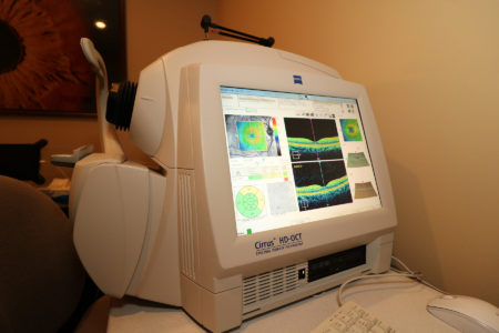 A computer monitor sitting on top of a desk.